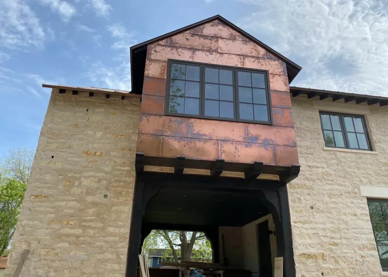 Copper metal panel facade on a stone building for Metal Roof Coating in Bargersville